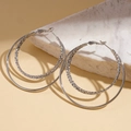 Detail of silver double layered hoop earrings with textured inner ring on a stone - 18K Gold Plated / 925 Sterling Silver Earring Post / Silver