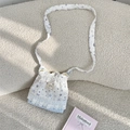 Detailed top view of a white drawstring crossbody bag with lace trim and star patterns - Star Bear Style