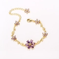 Elegant gold flower bracelet featuring purple zircon petals and crystal vine leaves - Gold-Purple