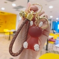 Detail of red resin bear keychain with rhinestones and brown braided leather strap - Bear Shape (Dian Zhuan Guo Dong Tu) / Caramel color