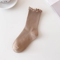 Light brown ribbed mid-calf socks with ruffle edge trim in a cozy minimalist style - One Size / Light Coffee
