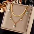 Double-layered gold necklace with evil eye pendants and zircon charms on beige leather - Layered Blue Eye Snake Chain Style (N1917)