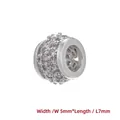 Macro shot of 7mm silver spacer bead with flower pattern and inlaid cubic zirconia - Platinum Hollow Flower Small (5*7MM)