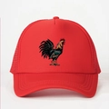 Detailed close-up of a red mesh trucker hat with a colorful rooster print on the front - One Size / Red