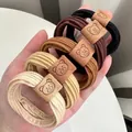 Elastic ribbed hair ties in brown coffee tones featuring cute cartoon bear leather patches - Bag Packaging / 25# Bear Style