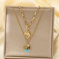Close-up of double-layered gold necklace featuring dolphin and palm tree beach pendants - Dolphin Coconut Tree Round Double Layer Style (KN292149-SXSJ)