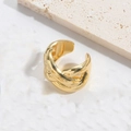 Close-up of a polished gold crisscross ring featuring a vintage French design on a stone base - Crossing Type / Gold