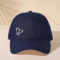 Detailed view of deep blue baseball cap featuring white double heart print and reinforced brim - Navy Blue