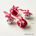 Set of 4 red and white metal Christmas bells with snowflake patterns and plaid bows - Snowflake Bell Set (4 Pieces)