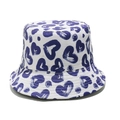 Detailed view of a white bucket hat featuring blue heart patterns on twill cotton fabric - White