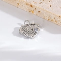 Close-up of a silver heart pendant with LOVE engraving and a clear zircon stone - Silver LOVE Textured Heart