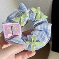 Blue plaid scrunchie with light green ribbons and handmade label detail - Blue Plaid Bow