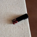 Detailed close-up of a black velvet hair claw clip with a decorative red cherry charm - Red Cherry Black Velvet Duckbill Clip