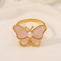 Detailed close-up of a golden butterfly ring with pink marble wings and white pearl center - Z1198-PI Pink Texture Butterfly