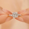 Elegant silver halo ring with round solitaire and twisted pavé band held by hand - Aurora Heart Ring Ljz-96 / Adjustable Open
