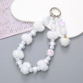 White plush ball and beaded phone wristlet featuring heart-shaped Boo letter beads - White Pompom Pendant Style (K2673)