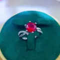 Close-up of a 2ct red ruby ring in a green velvet box with intricate six-prong setting - A10 Open Type / Red
