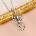 Detail shot of antique silver skull and spider pendant necklace on a beige background - Skull Spider Style (Silver-Tone - Tibetan Silver Necklace - 6)