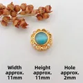 Detail of 11mm golden flower charm with blue opal and small white pearls for jewelry DIY - Style 5