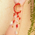 Golden moon suncatcher with red amethyst stones and crystals in natural sunlight - Red Glass with Octagonal Beads & Crystal Teardrop