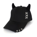 Detail of black punk baseball cap featuring devil horns and silver metal ring accents - Cross Stitch Black