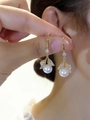 Elegant gold pearl drop earrings with micro-pave crystal leaves worn on ear - A980 Gold-Hooks (Pearl Leaf)