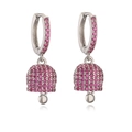 Close-up of silver bell earrings with vibrant magenta pavé crystals on a white background - Platinum Plated Rose Red Zirconia