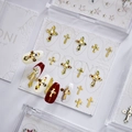 Golden cross nail art charms with rhinestones and pearls on various colorful nails - Gold Cross Style (MD-013) / Box Packaging