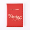 Detail of red PU leather passport cover with gold embossed adventure quote and icons - Red