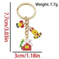 Christmas keychain with reindeer and house charms, including weight and size details - Snow House Reindeer Bow Bell (ER1772)