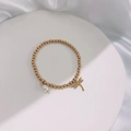 Detail of 18k gold plated beaded bracelet with white pearl and dragonfly pendant charm - Gold-Dragonfly