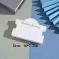 Close-up of white paper jewelry display card sized 10x7.2cm with Fashion Jewelry text - White 10*7.2CM