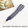 Close-up of blue and white striped woven wide shoulder strap with gold metal hooks - Blue White with Blue Trim