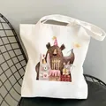 White canvas tote bag with cartoon animal birthday print on a black wire chair - C17 Animal Birthday Party