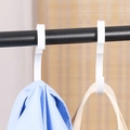 White S-shaped plastic utility hooks for hanging bags and clothes on a metal bar - Gourd Hook 4 Pack