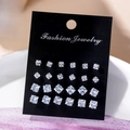 Detailed view of 12 pairs of square zircon stud earrings arranged by size on black card - Gradient Square Style (2876-4)