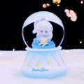 Blue musical snow globe featuring a girl with a guitar and DreamStar embossed base - 8014 Blue Base / Medium Size 80 With Snow Lights And Music