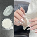 Fine aurora nail powder in transparent jar with iridescent mirror effect on long nails - Aurora White