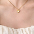 Golden heart pendant necklace featuring a centered cat eye stone on a delicate chain - Gold Heart Necklace Inlaid with Opal / Gold