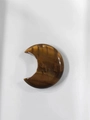 Polished brown tiger eye crescent moon stone pendant with unique natural banded texture - Tiger Eye