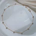 Elegant gold chain necklace with round white pearls on a minimalist white ceramic plate - Style 3 (Gold Plated Copper) / Gold