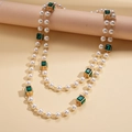 Close-up of double-layer faux pearl necklace with green square gems and gold links - Necklace-Green Style