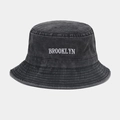 Detail of Brooklyn embroidery on washed denim bucket hat with reinforced stitching brim - Black