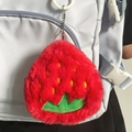 Plush strawberry coin purse keychain with red fuzzy texture and green leaf detail - Strawberry