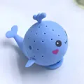 Blue whale-shaped silicone tea infuser with fine strainer holes and cute cartoon face - Blue Bath Whale