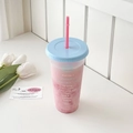 Close-up of clear reusable straw cup with blue lid and pink drink beside white tulips - 700ml / Large Sea Salt Cake