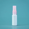 White refillable spray bottle with a pink pump and clear cap against blue background - 20ml / Porcelain White Bottle Pink Spray