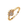 Detailed close-up of adjustable sun-shaped ring featuring gold plating and white zircons - Gold Sun