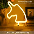 Unicorn neon night light with warm yellow glow and round white base, battery or USB powered - Small Unicorn Warm Light