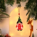 Wooden Christmas gnome ornament with red green plaid hat on a festive tree branch - Style 7 (Red/Green Plaid Hat Gnome)